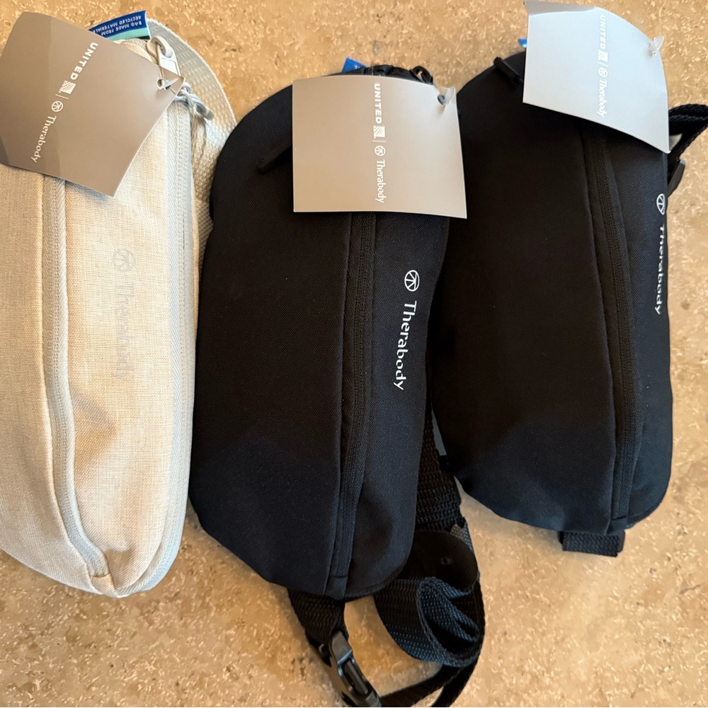 Therabody Black and Cream Bags United Airlines.